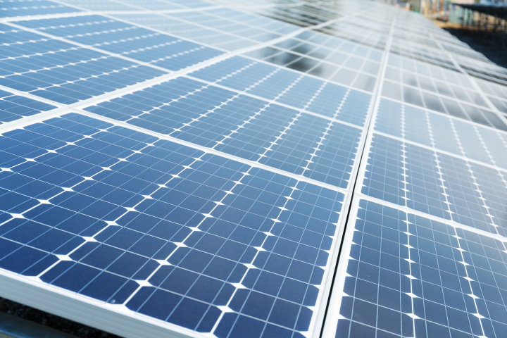 Close-up photo of solar panels. Panels look blue from the side.