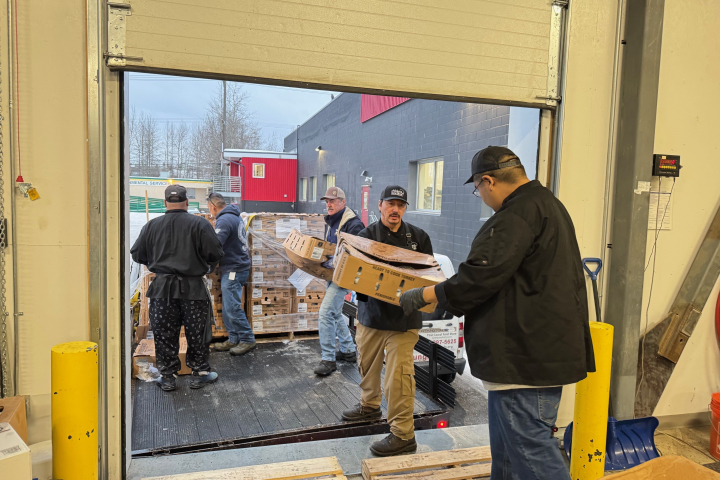 Turkeys are unloaded on a loading dock