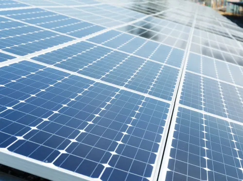 Close-up photo of solar panels. Panels look blue from the side.