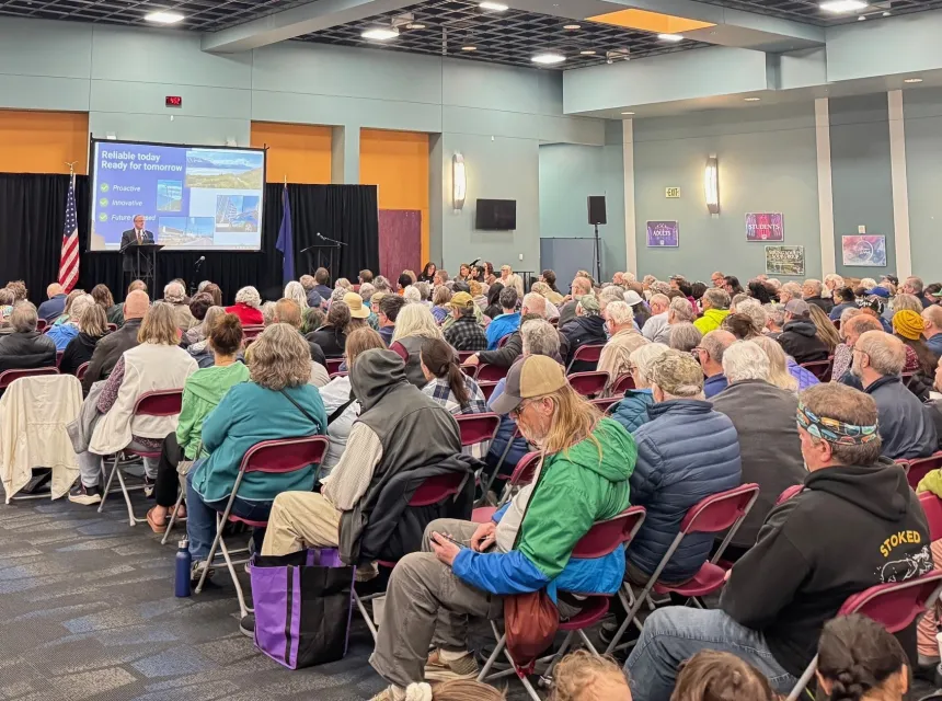 CEO Arthur Miller speaks to a crowd at the 2025 Chugach Electric Annual Meeting.